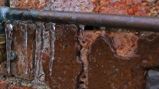 How can I prevent frozen pipes during the cold season?  