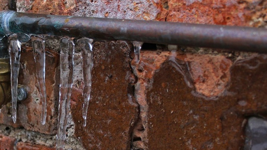 How can I prevent frozen pipes during the cold season?  